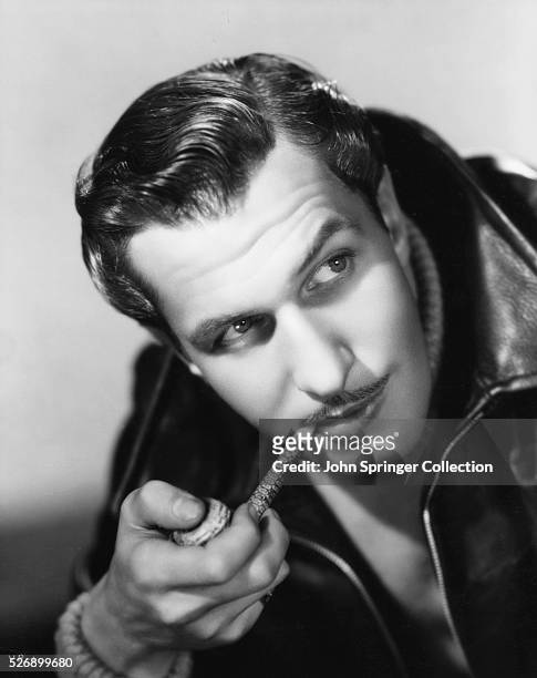 Actor Vincent Price Holding Pipe