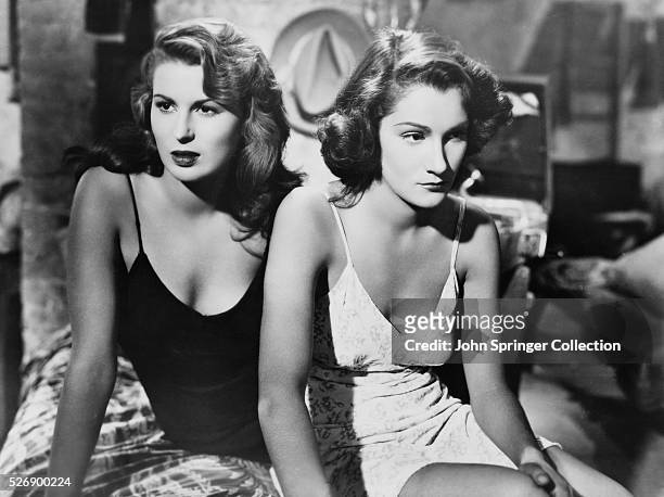 Actresses Silvana Mangano and Doris Dowling wear slips for their role in Bitter Rice.