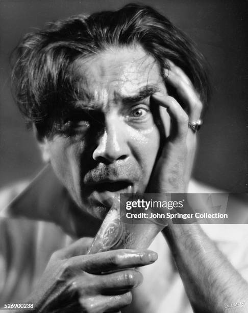 Actor Bela Lugosi Holding a Shot Glass