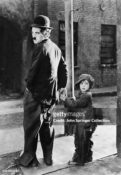 Charles Chaplin and Jackie Coogan in The Kid
