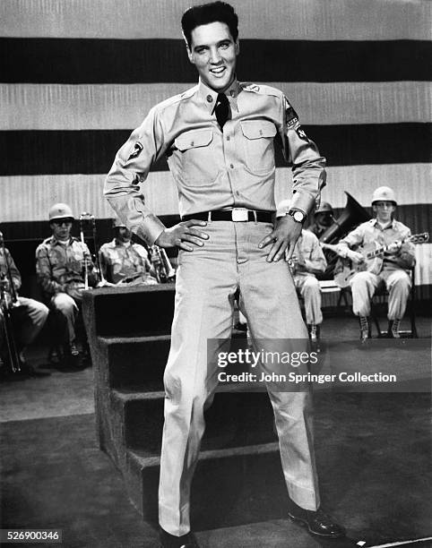 Movie still from the film "G.I. Blues," with Elvis Presley in uniform once again in his first post-Army film, Hall Wallis' "G.I. Blues," romantic...