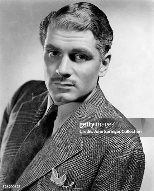 Head and shoulder portrait photo of English actor Sir Laurence Olivier . Undated photograph.