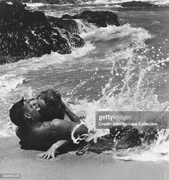 Burt Lancaster and Deborah Kerr as Milton Warden and Karen Holmes in their famous surfside kiss in From Here to Eternity.