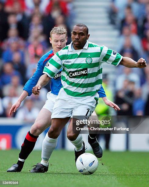 Celtic's Didier Agathe evades a tackle from Rangers' Michael Ball during Scottish Premier League match between Glasgow Rangers and Celtic at Ibrox,...