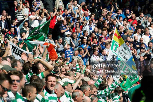 Rangers and Celtic fans urge on their teams during the Scottish Premier League match between Glasgow Rangers and Celtic at Ibrox, April 24 Glasgow...