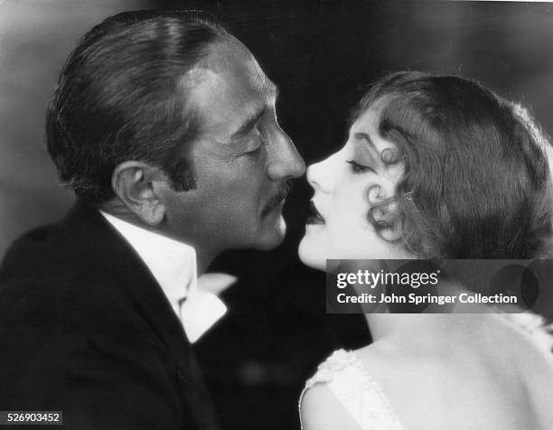 Adolphe Menjou as Franz Rossi and Lina Basquette as The Dancer sharing a kiss in Serenade. Motion Picture, 1927.