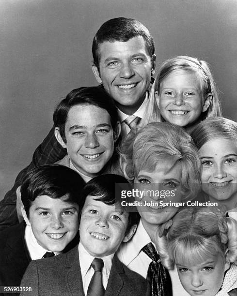 Publicity handout of the cast of "The Brady Bunch" television series, all beaming with their heads stacked on top of each other. Ca. 1970s.