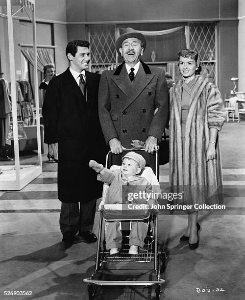 Dan Merlin and Polly Parish let grandfather J.B. Merlin show the department store his new grandchild in the 1956 film Bundle of Joy.