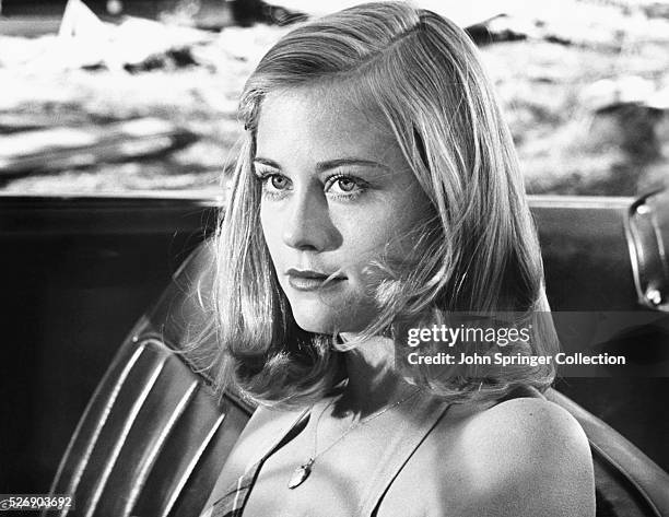 Jacy Farrow sits in the driver's seat of a car in a scene from the 1971 film The Last Picture Show.