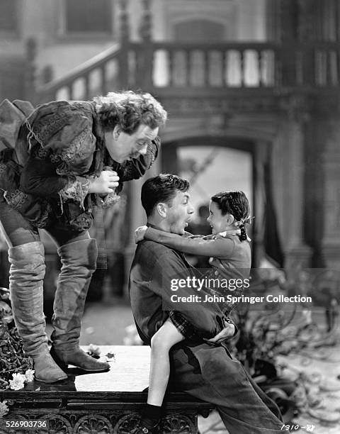 Charles Laughton as the ghost of Sir Simon de Canterville, William Gargan as Sergeant Benson, and Margaret O'Brien as Jessica de Canterville in the...