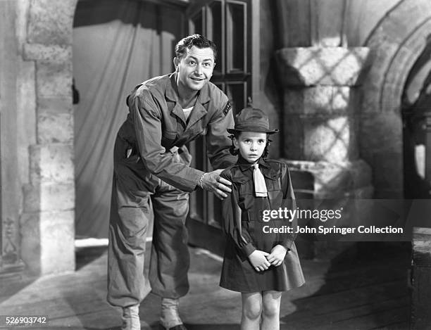 Robert Young as Cuffy Williams and Margaret O'Brien as Jessica de Canterville in the 1944 film Canterville Ghost.