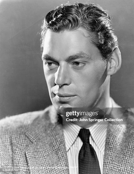 Photo shows a close-up profile of the American actor, Johnny Weissmuller. Shown here a publicity handout from the 1948 movie, "Tarzan's New York...