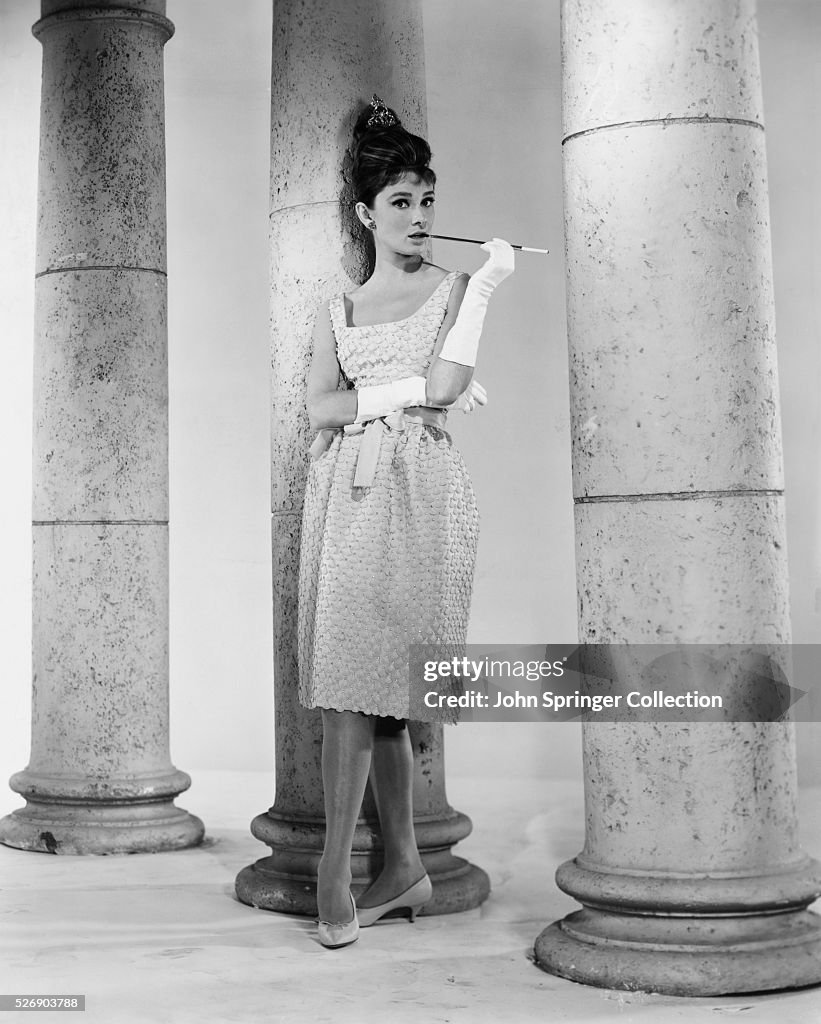 Audrey Hepburn Smoking Alongside Columns