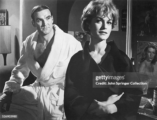 Johnny Bannion and Suzanne don bathrobes in a scene from the 1960 film The Criminal.