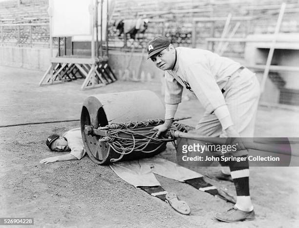 Babe Ruth rolling over Lou Archer in the silent comedy Babe Comes Home, 1927.