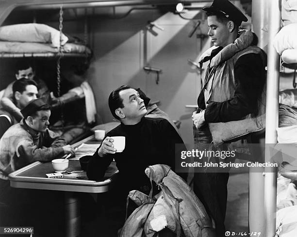 Edward G. Robinson as retired navy officer Steve Boleslavski with Glenn Ford as Mickey Donohue in the 1943 film Destroyer.