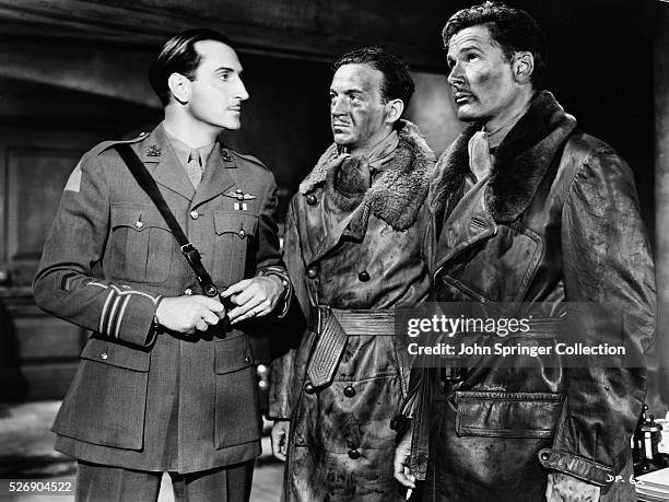 Basil Rathbone as Major Brand, David Niven as Lieutenant Douglas "Scotty" Scott, and Errol Flynn as Captain Courtney in the 1938 film The Dawn Patrol.