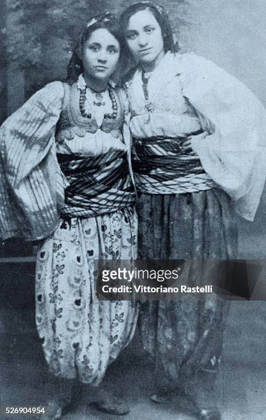 The young Albanian born Anjezë Gonxhe Bojaxhiu, future Mother Teresa of Calcutta, with her sister Aga, in Macedonian traditional costume, circa 1925.