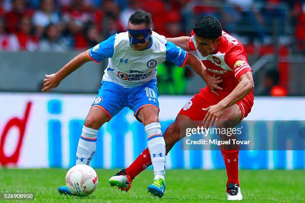 Francisco Gamboa of Toluca fights for the ball with Chistian Gimenez of Cruz Azul during the 16th round match between Toluca and Cruz Azul as part of...