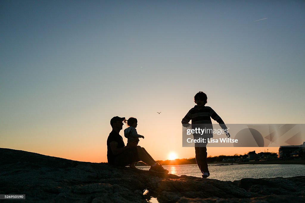 Silhouette of father with his daughter