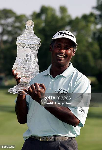 Vijay Singh of Fiji poses with trophy after his victory over John Daly in a one hole playoff during the final round of the Houston Open on April 24,...