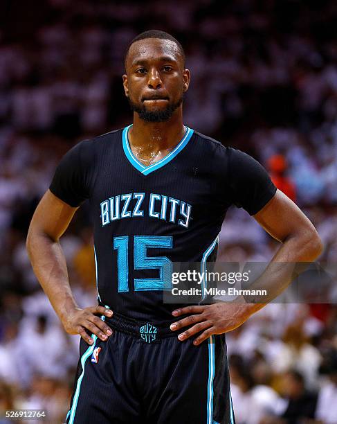 Kemba Walker of the Charlotte Hornets looks on during Game Seven of the Eastern Conference Quarterfinals of the 2016 NBA Playoffs against the Miami...