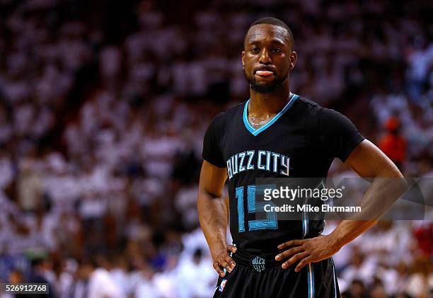 Kemba Walker of the Charlotte Hornets looks on during Game Seven of the Eastern Conference Quarterfinals of the 2016 NBA Playoffs against the Miami...