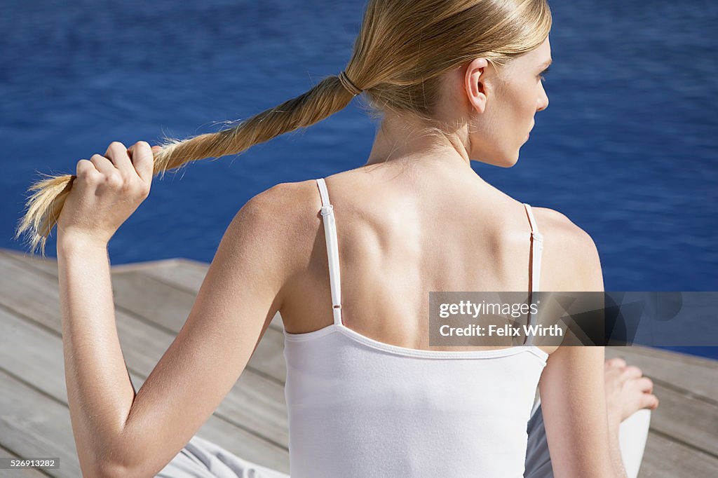 Woman twisting hair