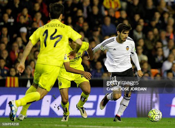 Valencia's Portuguese midfielder Andre Gomes controls the ball during the Spanish league football match Valencia CF vs Villarreal CF at the Mestalla...