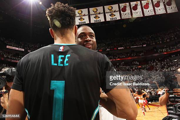 Dwyane Wade of the Miami Heat shakes hands with Courtney Lee of the Charlotte Hornets after winning Game Seven of the Eastern Conference...
