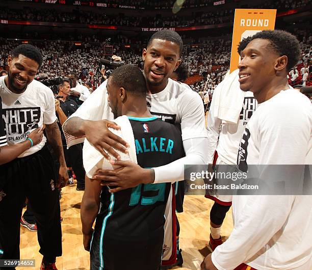 Joe Johnson of the Miami Heat shakes hands with Kemba Walker of the Charlotte Hornets after winning Game Seven of the Eastern Conference...