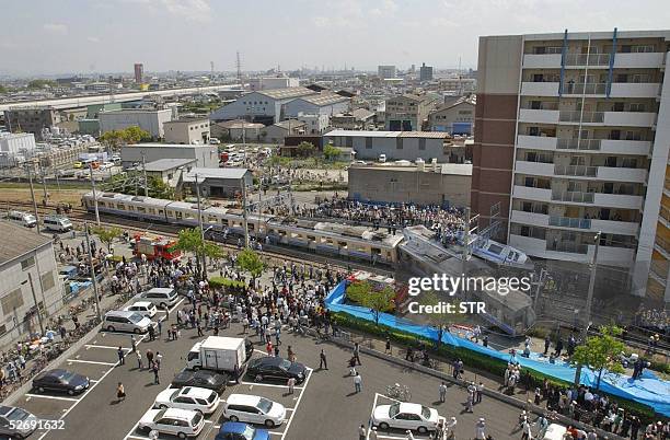 Over view of the train crashed site in Amagasaki Hyogo prefecture, 25 April 2005. At least three people were killed and 140 others were injured 25...