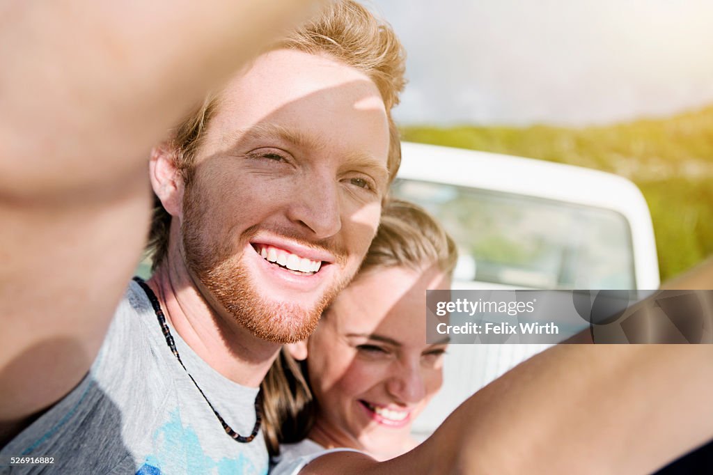 Couple shielding eyes from sunlight