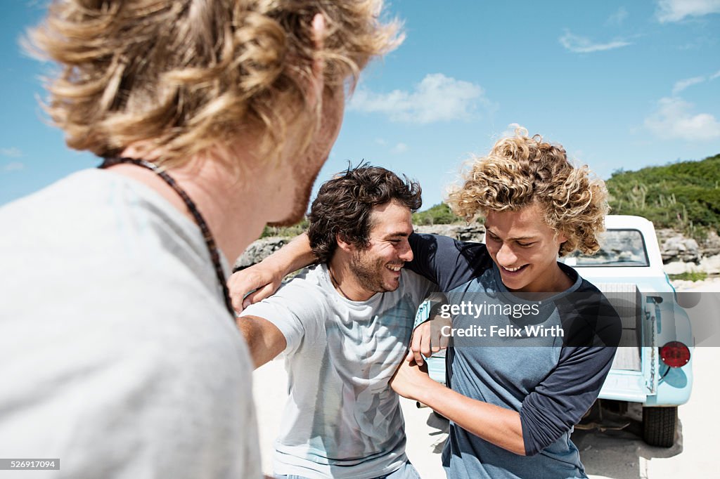 Three young friends on beach