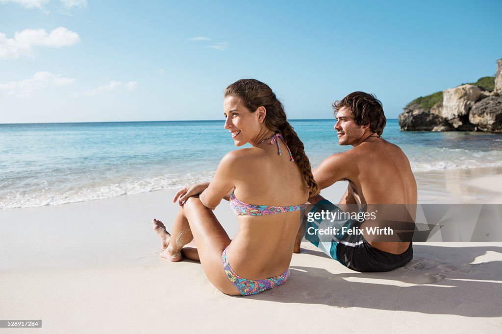 Couple sitting on beach