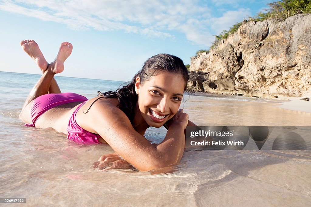 Woman lying on beach