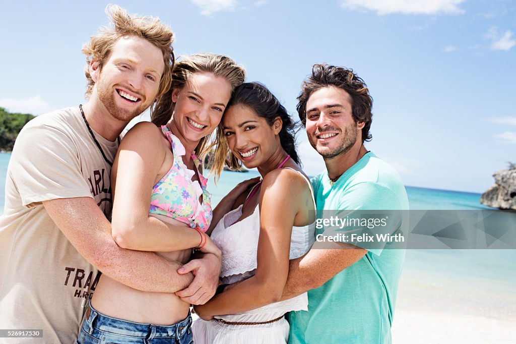 Portrait of young friends on beach