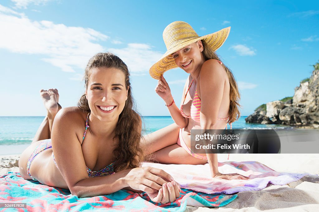 Women sunbathing on beach