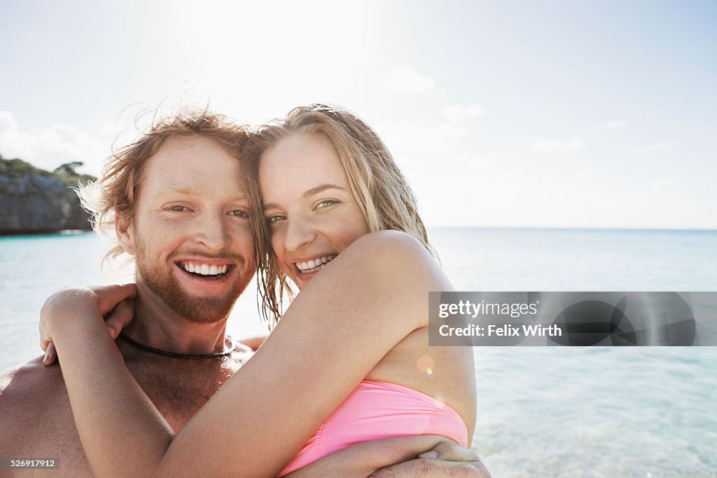 Young couple embracing on sea shore