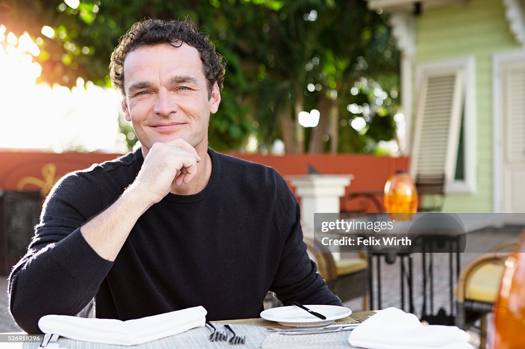 Portrait of man in outdoor restaurant