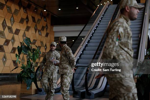 Military guards keep watch in the lobby of the Libyan General National Congress in Tripol, Libya on March 10, 2015. The seat of power in western...