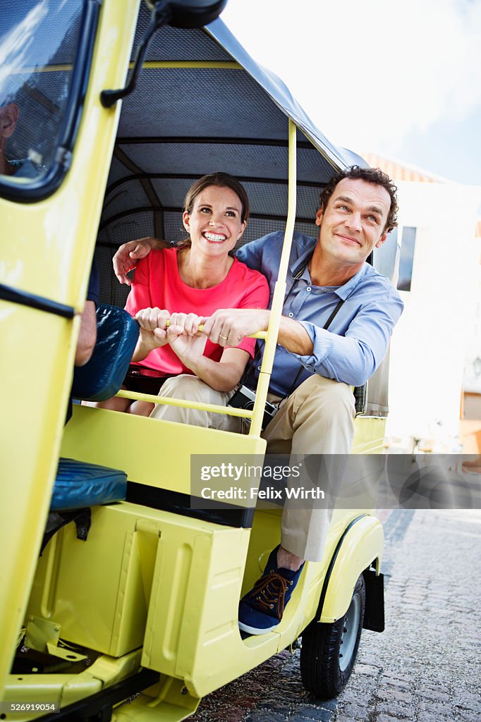 Tourists sightseeing from tuk tuk