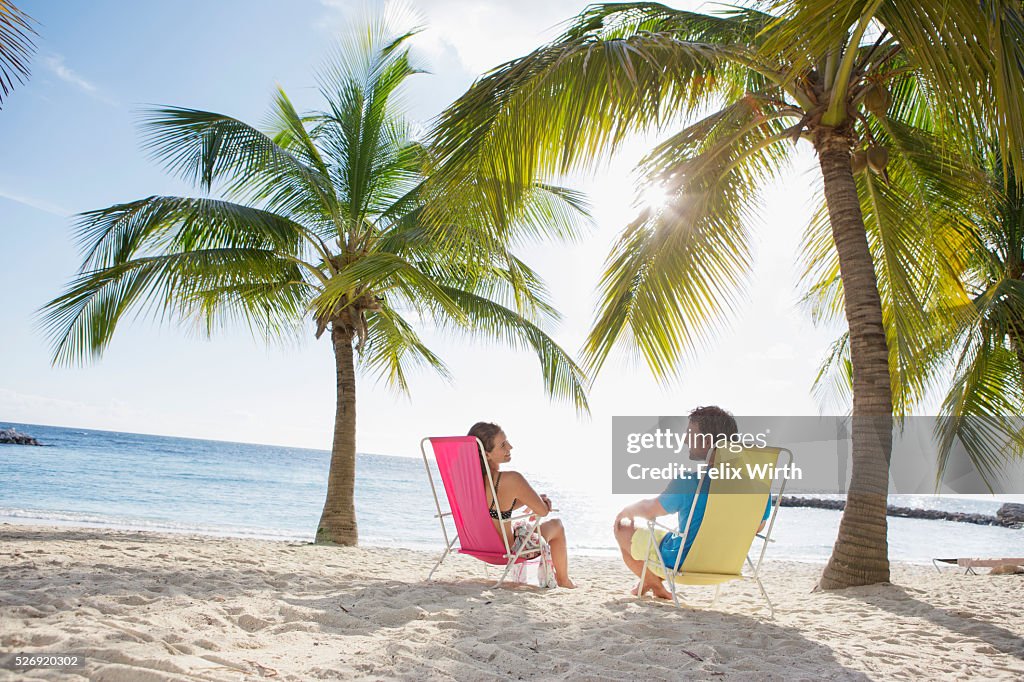 Woman relaxing on beach lounger
