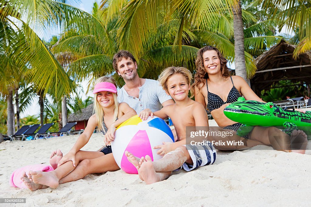 Family on beach on summer day