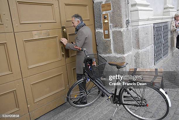 Copenhagen/Denmark/ 21th September 2015_ Francois Zimeray French ambassador to Denmark arrives by bicycle at embassy and high lights Franch -Danish...