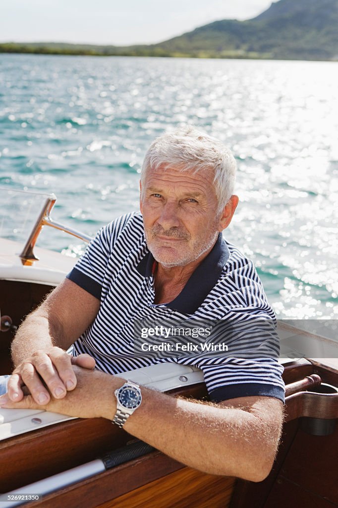 Portrait of senior man in motorboat