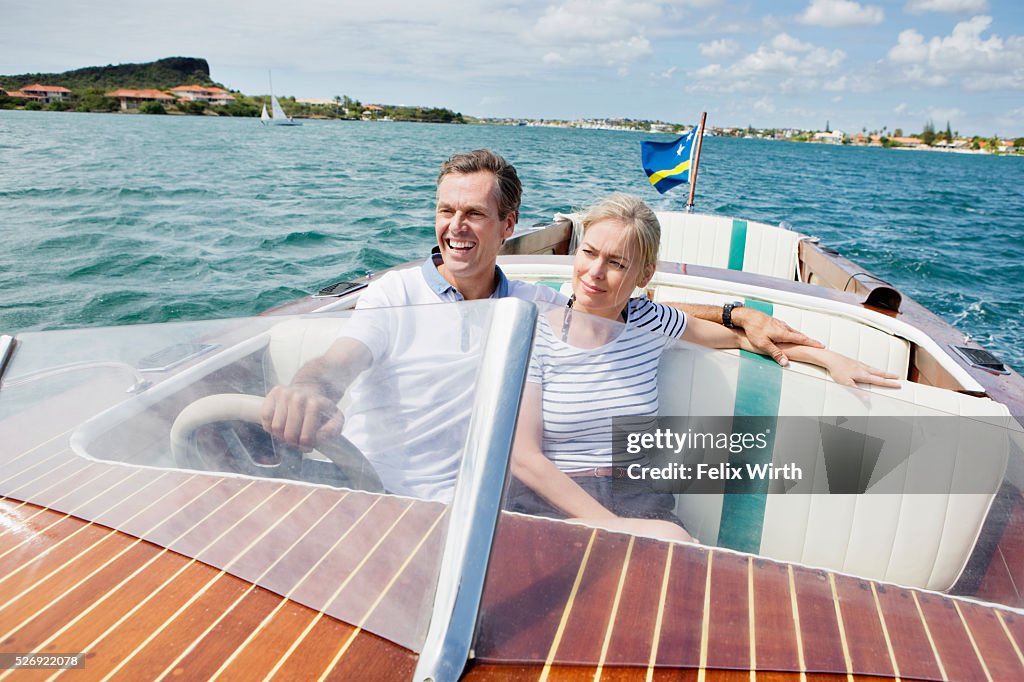 Couple riding speedboat