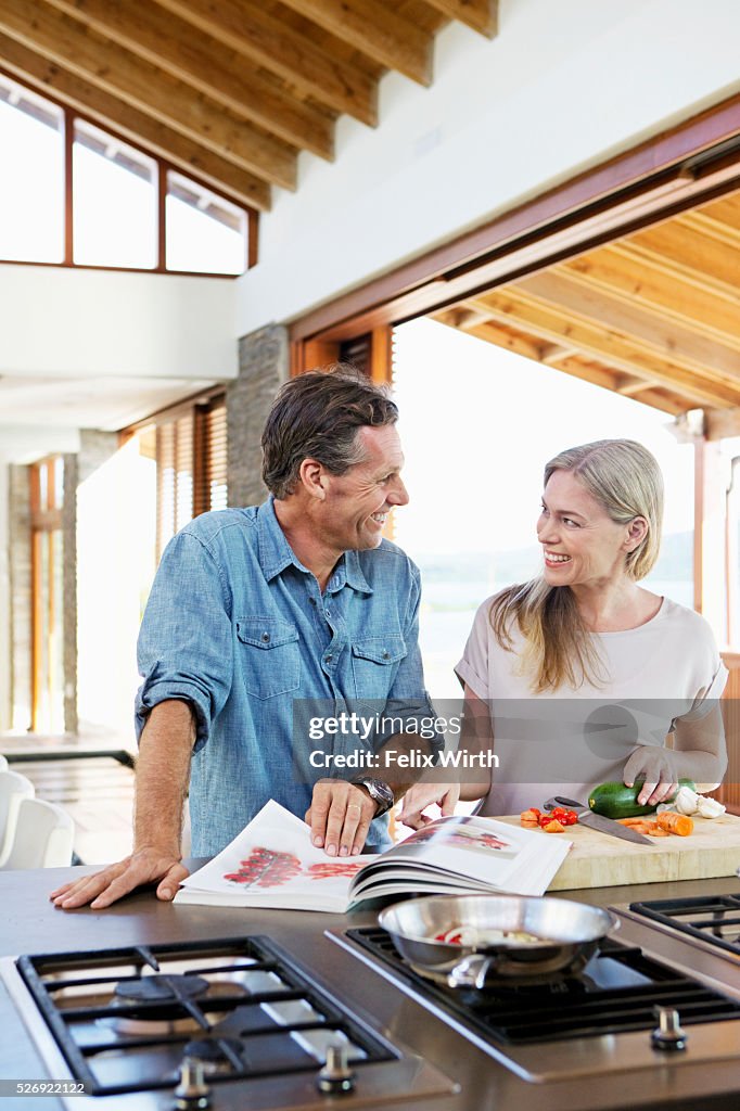 Middle-aged couple cooking together