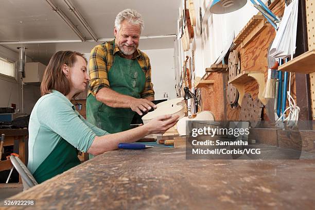 two luthiers in workshop - instrument maker stock pictures, royalty-free photos & images