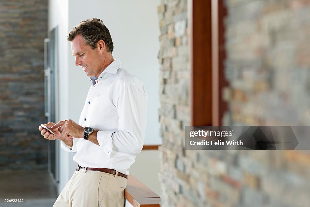 Middle-aged man texting